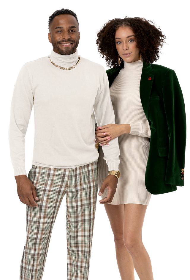 Model in green and brown plaid fancy fashion pants by EJ Samuel, style PL64, styled with a cream turtleneck